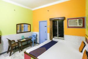 Voodi või voodid majutusasutuse Hotel O Bideshini Hotel toas