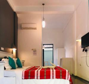 Ένα ή περισσότερα κρεβάτια σε δωμάτιο στο Hotel Vibration