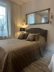 Posteľ alebo postele v izbe v ubytovaní Apartamencik Królewiecka