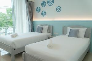 Postel nebo postele na pokoji v ubytování Apo Hotel