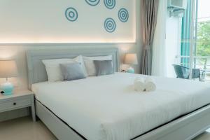 Postel nebo postele na pokoji v ubytování Apo Hotel