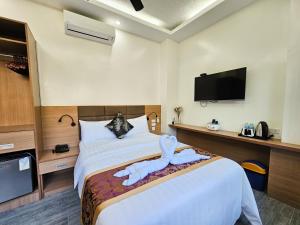 Postel nebo postele na pokoji v ubytování Serenity Beach Hotel