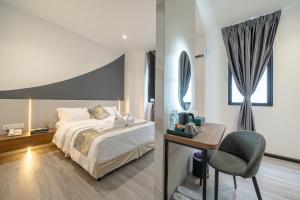 Postel nebo postele na pokoji v ubytování Saturn Hotel + 33 fotografií