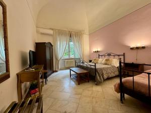 Posteľ alebo postele v izbe v ubytovaní Aedes B&B Il Giardino dei Sogni