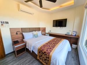 Postel nebo postele na pokoji v ubytování Serenity Beach Hotel