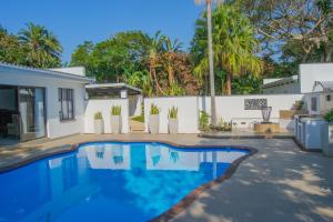 a swimming pool in the backyard of a house at Ashton Villa in Port Edward
