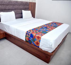 Postel nebo postele na pokoji v ubytování Hotel Pride Inn