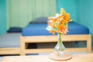 a vase with flowers in it sitting on a table at Rio de Janeiro to Conakry KIPE in Conakry