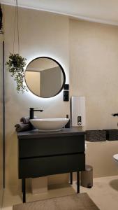 a bathroom with a sink and a mirror at Sunrise Apartment in Schladming +32 photos