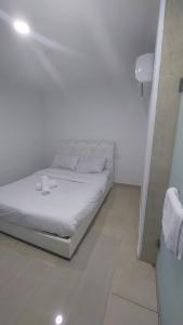 Postel nebo postele na pokoji v ubytování ONE AMPANG HOTEL