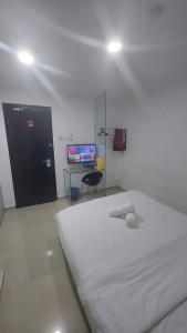 Postel nebo postele na pokoji v ubytování ONE AMPANG HOTEL