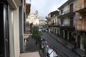 a view of a street from a balcony of a building at Casa Vacanze Happy Home in Zafferana Etnea