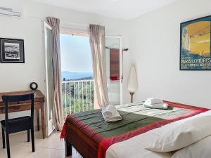 Ένα ή περισσότερα κρεβάτια σε δωμάτιο στο Villa 13 oliviers Couchers de soleil LUMIO +32 φωτογραφίες