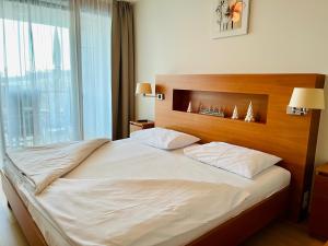 Postel nebo postele na pokoji v ubytování Golf & Relax Apartment mit 4*S-Anbindung + 21 fotografií