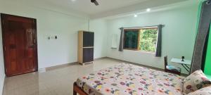 Postel nebo postele na pokoji v ubytování Happy Moon Homestay