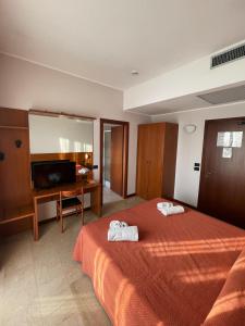 Postel nebo postele na pokoji v ubytování Aba Hotel