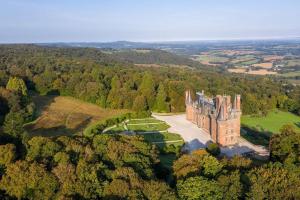 an aerial view of a castle in the forest at The nest in Spézet