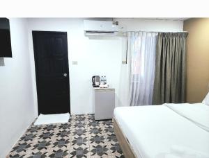 Postel nebo postele na pokoji v ubytování Burning flame Hotel