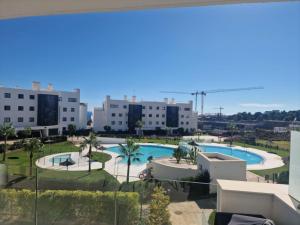a view of a swimming pool from a building at higuerón Aqualis in Torremuelle