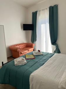 Postel nebo postele na pokoji v ubytování Falaride suite Agrigento discesa sulla valle di oro