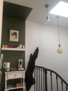 a staircase with a black bird statue on the wall at La Canopée in Bordeaux
