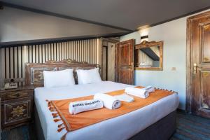 Postel nebo postele na pokoji v ubytování Wonder Wood Hotel