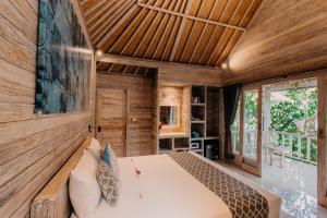 Postel nebo postele na pokoji v ubytování Lebaoh Nusa Cottage + 37 fotografií