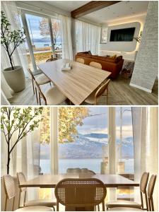 a living room with a table and a large window at Villa Cecilia Luxury Stay in Kastoria
