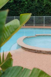 a large swimming pool with aitatingfficientfficientfficientfficientfficientfficientfficient at Kyriad Cannes - Mandelieu in Cannes