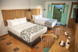 Postel nebo postele na pokoji v ubytování Alfahar Hotel