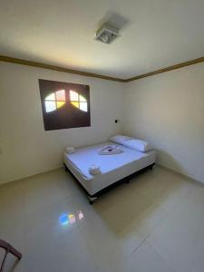 Ένα ή περισσότερα κρεβάτια σε δωμάτιο στο Refugio da Sereia