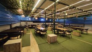 a restaurant with tables and chairs in a room at فندق أجياد Agyad Hotel in Asyut