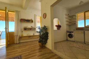 a kitchen with a washing machine in a room at Uğrak Home in Işıklı +25 photos