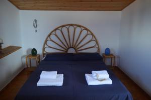 Postel nebo postele na pokoji v ubytování Bedda Casa Al Mare