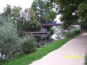 a path next to a river with a bridge at Appart 28m2 Metz Canal équipé meublé Wifi in Montigny-lès-Metz +2 photos