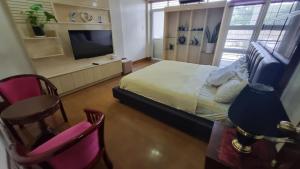 TV a/nebo společenská místnost v ubytování Baguio Brentwood Villas + 3 fotografie