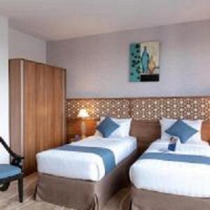Postel nebo postele na pokoji v ubytování Sunrise Ajyad Hotel