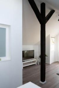 TV a/nebo společenská místnost v ubytování Zentrale Ferienwohnung