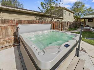 a hot tub in the backyard of a house at Reminiscent Downtown Cottage cottage in Grand Junction