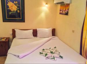Postel nebo postele na pokoji v ubytování Golden Europe Hotel