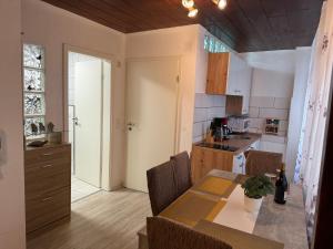 a kitchen with a table and a dining room at Via Roma 257 Apartament in Cochem