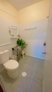 a bathroom with a toilet and a table at Grace House Prachuap in Ko Rom +46 photos