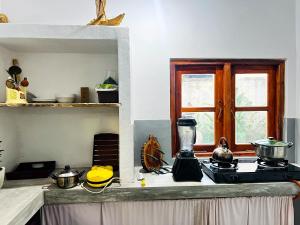 a kitchen with a counter top with a blender on it at 11 11 Weligama in Weligama
