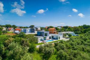 an aerial view of a residential neighborhood with houses at Villa Vivre in Ližnjan