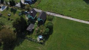 an aerial view of a house in a field at Agroturystyka u Dudków- Balia i Apiterapia in Jeleśnia