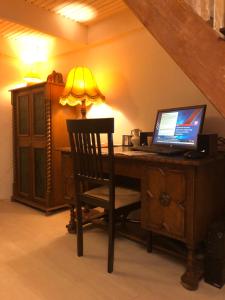 Televízia a/alebo spoločenská miestnosť v ubytovaní Bella Apartment