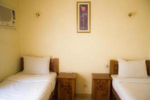 Postel nebo postele na pokoji v ubytování Golden Europe Hotel