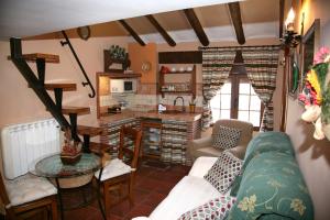 a living room with a couch and a table at Apartamentos Tío José María in Hinojares
