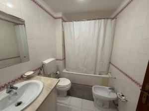 a bathroom with a sink and a toilet and a tub at T1 Manta Rota in Manta Rota +21 photos