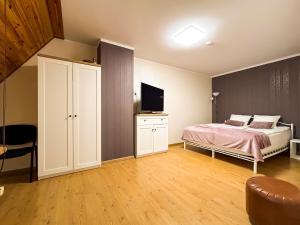 Łóżko lub łóżka w pokoju w obiekcie Apartament Deluxe